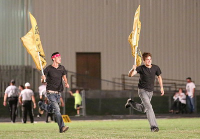 Image: Jack Hernandez and Brandon Connor take a victory lap after Italy’s 46-6 win over Itasca to begin district play.