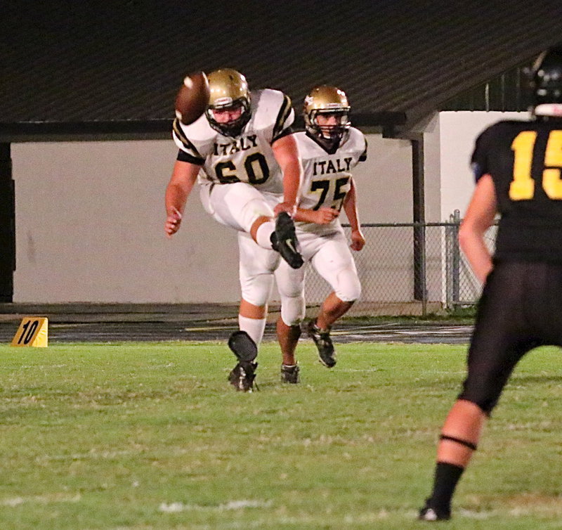 Image: Kevin Roldan(60) kicks off to Itasca as teammate Cody Medrano(75) starts upfield.