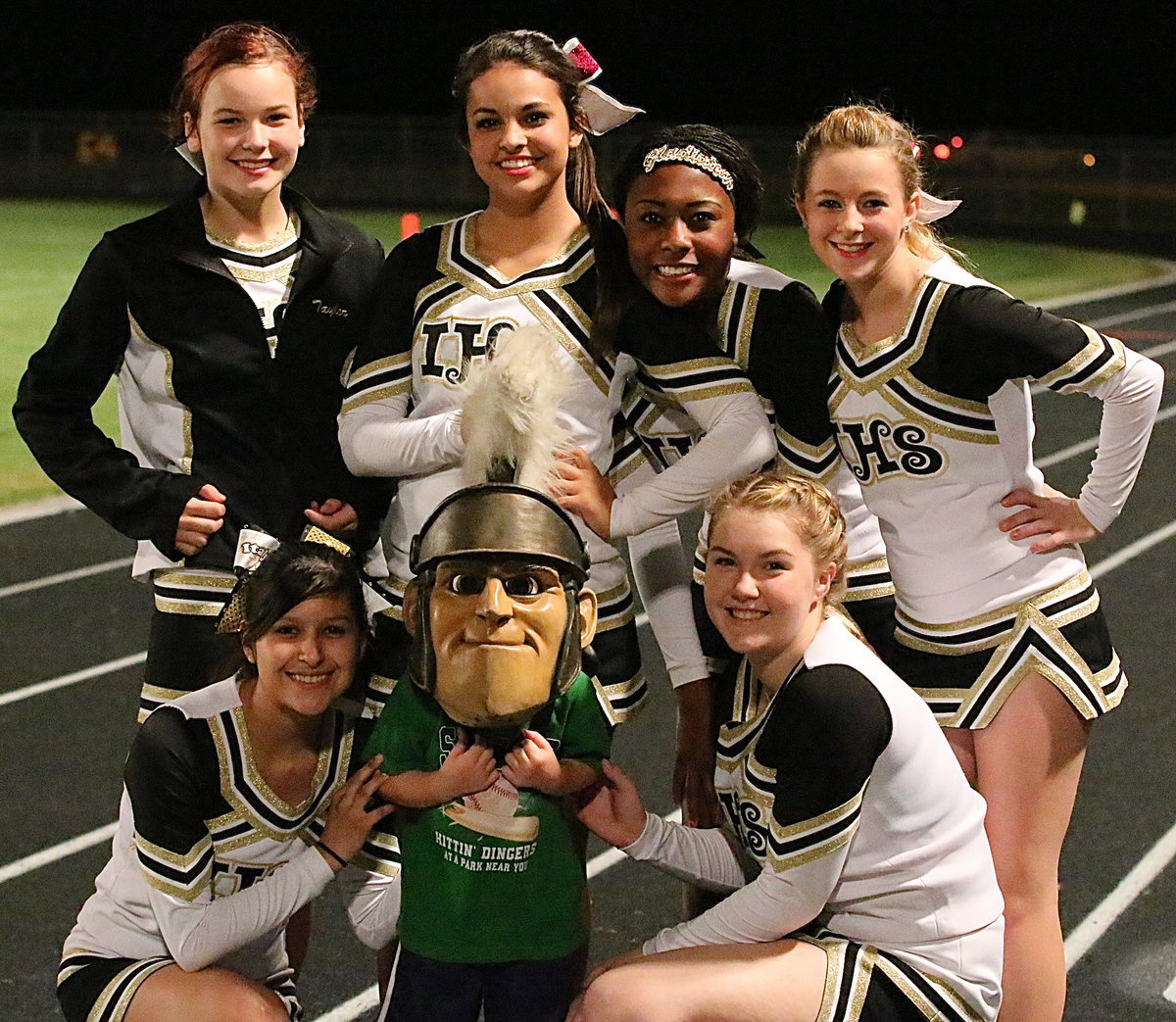 Image: Cheerleaders (back row) Paige Little, Ashlyn Jacinto, K’Breona Davis, Britney Chambers and (front row) Jessica Garcia pose with the Cady-ator.