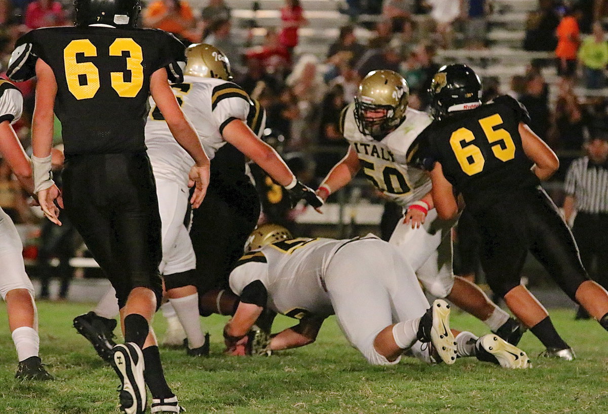 Image: John Byers(56) grabs a Wampus Cat runner by his back paw.