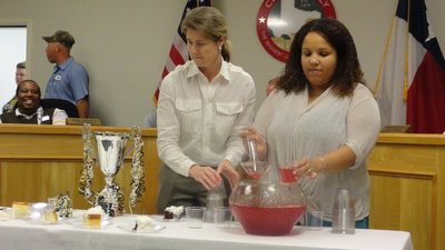 Image: Ronda Cockerham and Clarice Crocker provide cake and punch for the IYAA Proclamation Reception.