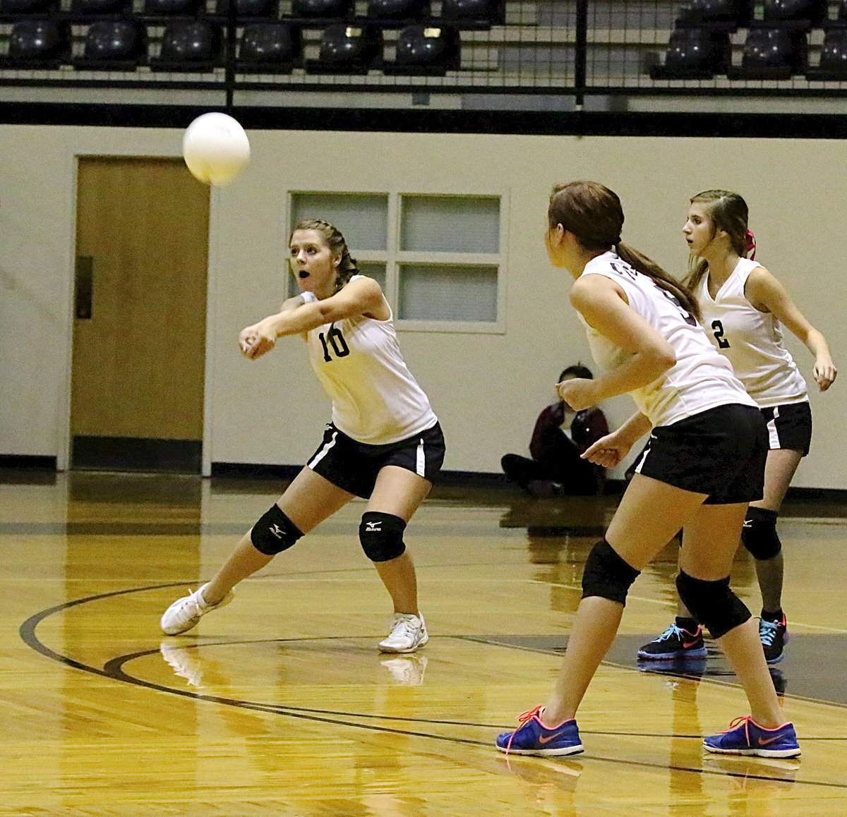 Image: Italy JV Lady Gladiator Brooke DeBorde(10) keeps the volley going against visiting Kopperl with teammates Paige Little(5) and Alison Pendley(2) ready to react.