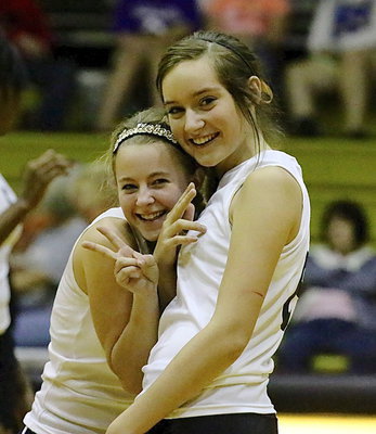 Image: Britney Chambers(1) and Jozie Perkins(8) have a bit of fun during Italy’s JV matchup against Kopperl.