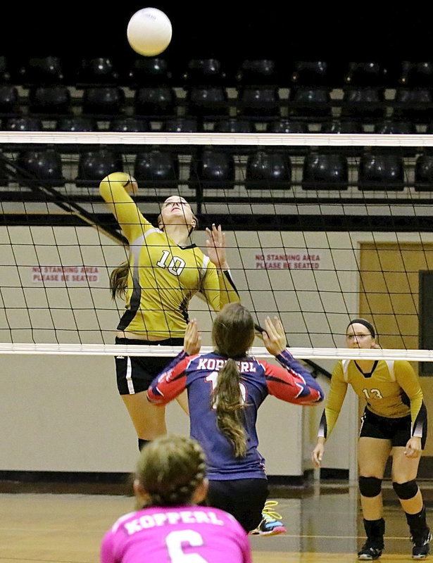 Image: Madison Washington(10) delivers a kill shot for the Lady Gladiators.