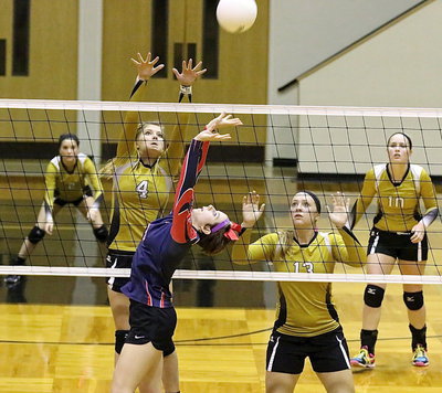Image: Halee Turner(4) and Jaclynn Lewis(13) time out their blocks against Kopperl.