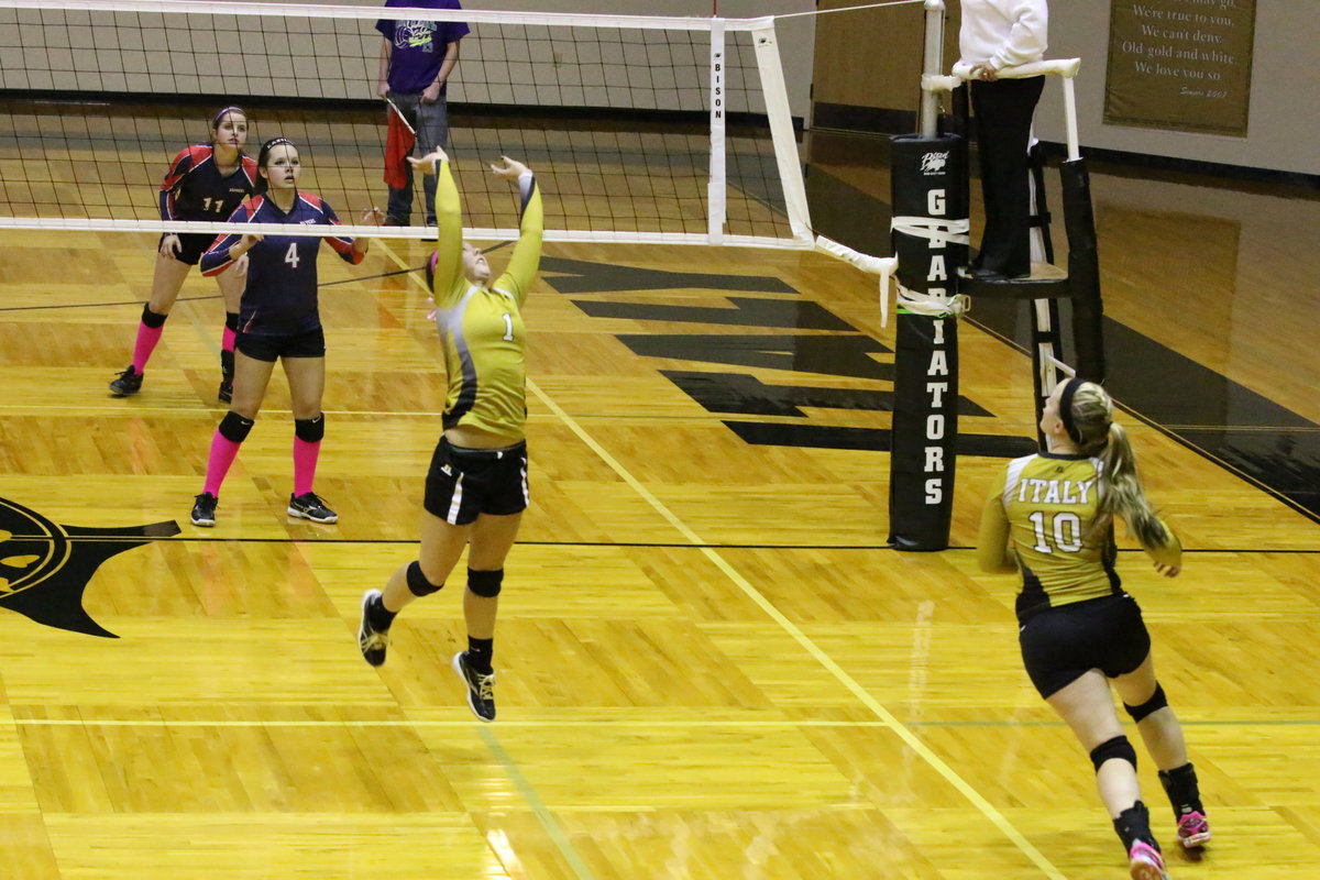 Image: Bailey Eubank(1) sets the ball for Madison Washington(10).