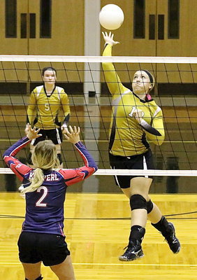 Image: Jaclyn Lewis(13) drills a dramatic kill shot that ties the 2nd set 23-23.