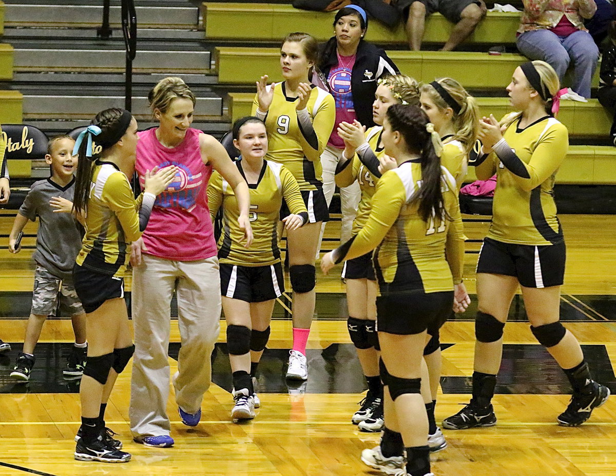 Image: Lady Gladiator head coach Morgan Mathews and assistant coach Tina Richards celebrate a momentum surge with their players.