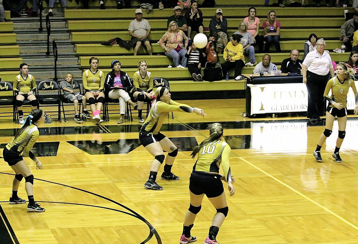 Image: Jaclynn Lewis(15) bumps the ball as teammates Cassdiy Childers(2), Madison Washington(10) and Halee Turner(4) move into position.