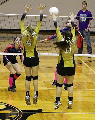 Image: Halee Turner(4) and teammate Paige Westbrook(11) get the block this time but, overall, Kopperl’s Ladies got just enough shots thru in order to win.