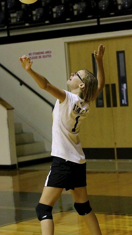 Image: Paige Cunningham(1) serves for Italy’s Junior High B-team against Frost.