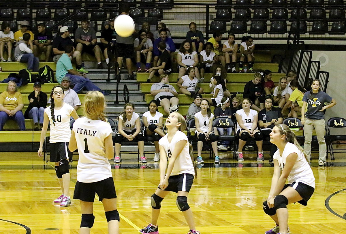 Image: Oh, the humanity: Karley Nelson(8) bumps the ball back to Frost as teammates Madison Galvan(10), Tatum Adams(1) and Cassidy Gage(14) react.