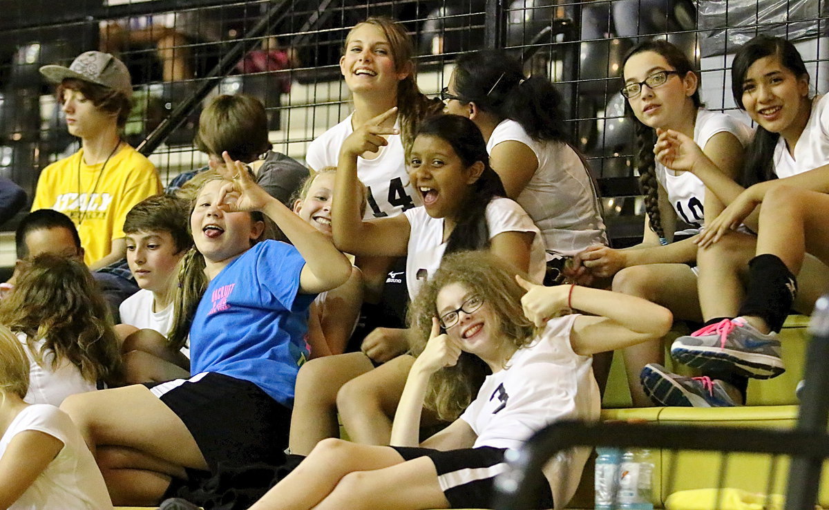 Image: Several Italy players chill in the stands while watching the action between Frost and Italy down on the floor.