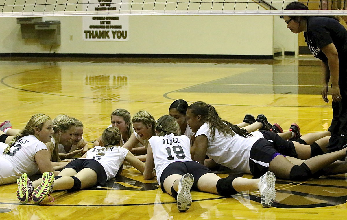 Image: Italy A-team junior high girls celebrate their success with Coach Tina Richards.