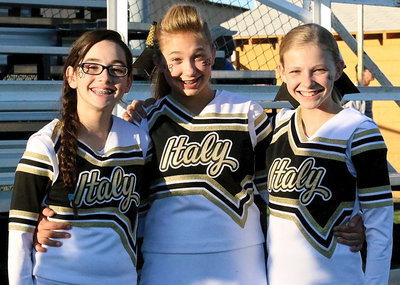 Image: Italy Junior High cheerleaders Madison Galvan, Maegan Connor and Taylor Boyd brighten the sidelines with their smiles.