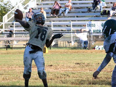 Image: Marcos Duarte launches a pass toward the end zone.