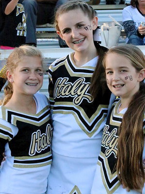 Image: Italy Junior High cheerleaders Karson Holley, THE Kirby Nelson and younger sister Karley Nelson love what they do.