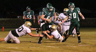 Image: Play side end Zain Byers(50) and backside end Bailey Walton(52) force the Bobcat QB to throw an incomplete pass.