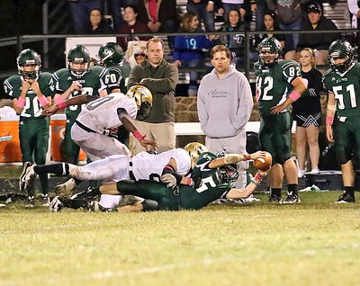 Image: Cody Boyd(88) tackles the Bobcats for a loss who failed to execute the old hook-n-ladder play.