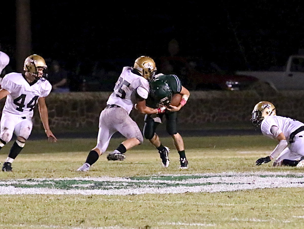 Image: Italy linebacker Shad Newman(25) makes an open-field tackle on a Bobcat ball carrier.