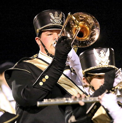 Image: Zac Mercer plays loud and proud for the Gladiator Regiment Marching Band and Color Guard during their dazzling halftime show.