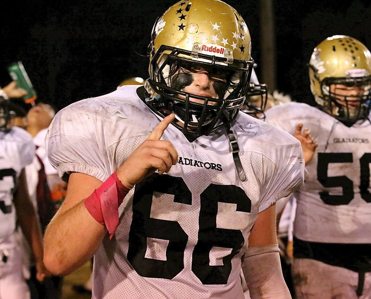 Image: Kyle Fortenberry(66) knows a win is a win especially on a sloppy field.