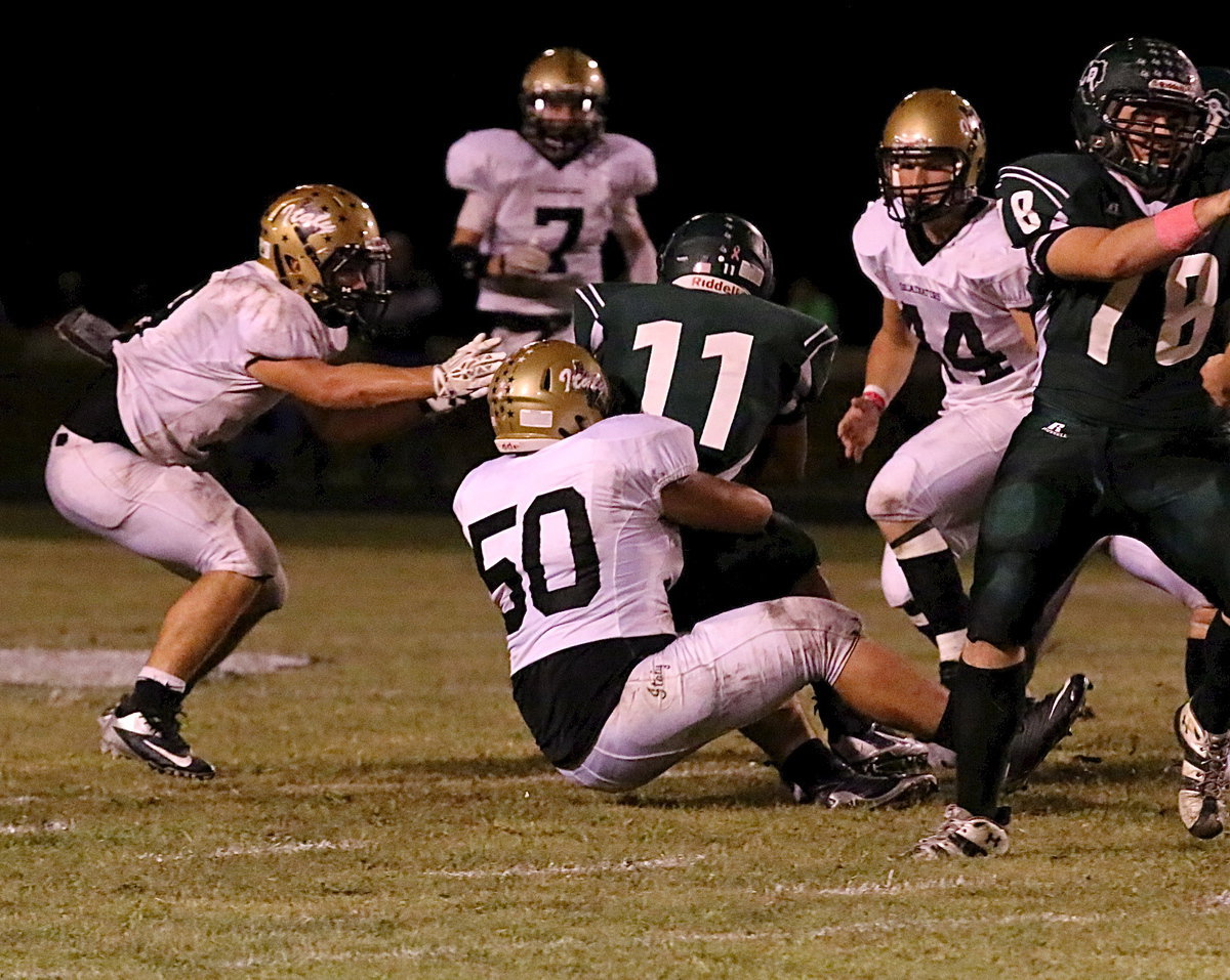 Image: Zain Byers(50) brings down a Bobcat running back.