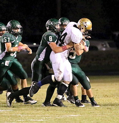 Image: Italy’s Coby Bland(44) gains a few yards before being wrapped up by several Bobcat defenders.
