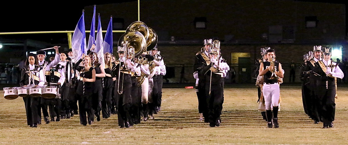 Image: The Gladiator Regiment Marching Band and Color Guard begin their halftime performance.