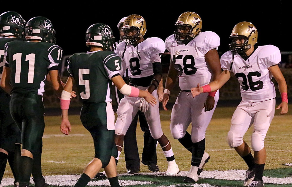 Image: Gladiator captains Trevon Robertson(8), Darol Mayberry(58) and Tyler Anderson(36) wish the Bobcat captains the best of luck.