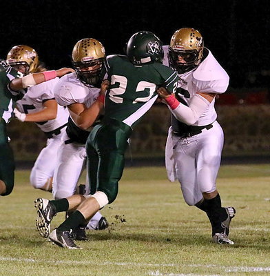 Image: Right guard Zain Byers(50) and center Kyle Fortenberry(66) double-team a Crossroad defensive lineman.