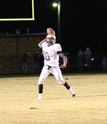 Image: TaMarcus Sheppard(10) completes a pass to his senior target, Trevon Robertson, who makes the catch for 4 yards.