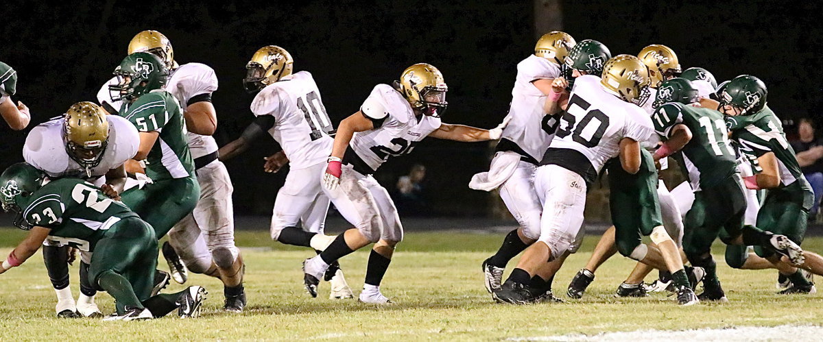 Image: Wide shot shows the blocking up front by the Gladiator offensive line.