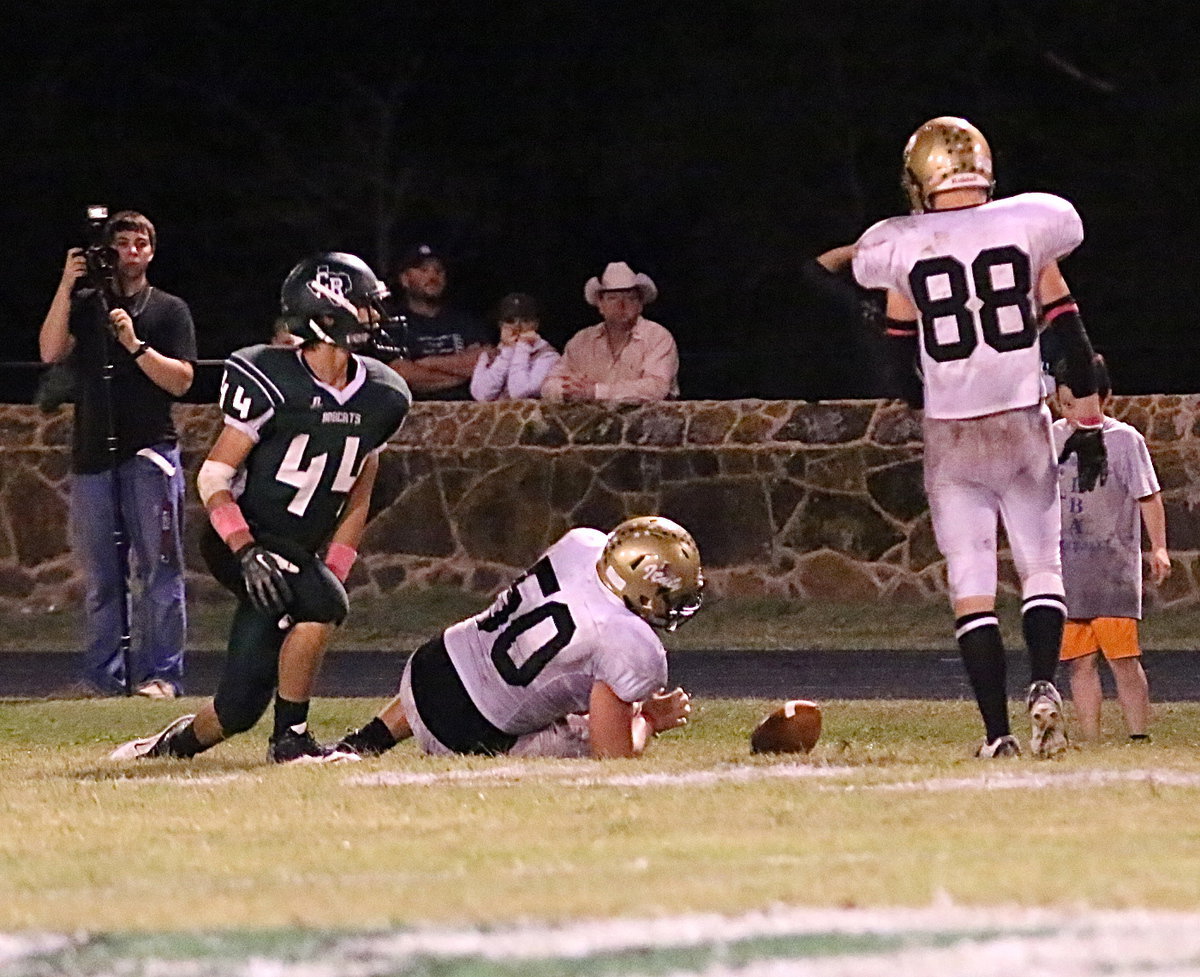 Image: Defensive end Zain Byers(50) drops into pass coverage and breaks up a pass attempt to stave off any last minute heroics by the Bobcats.