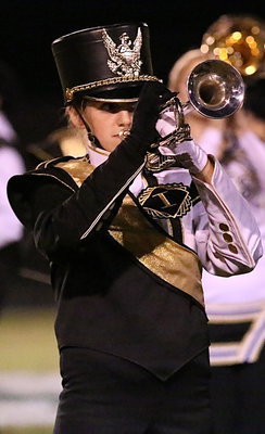 Image: Kirby Nelson plays her trumpet during halftime to entertain the Crossroads fans.