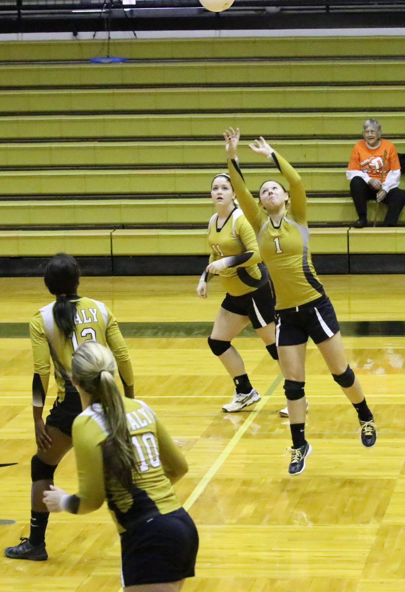 Image: Paige Westbrook(11), Kortnei Johnson(12) and Madison Washington(10) move into scoring position as Bailey Eubank(1) sets the ball.