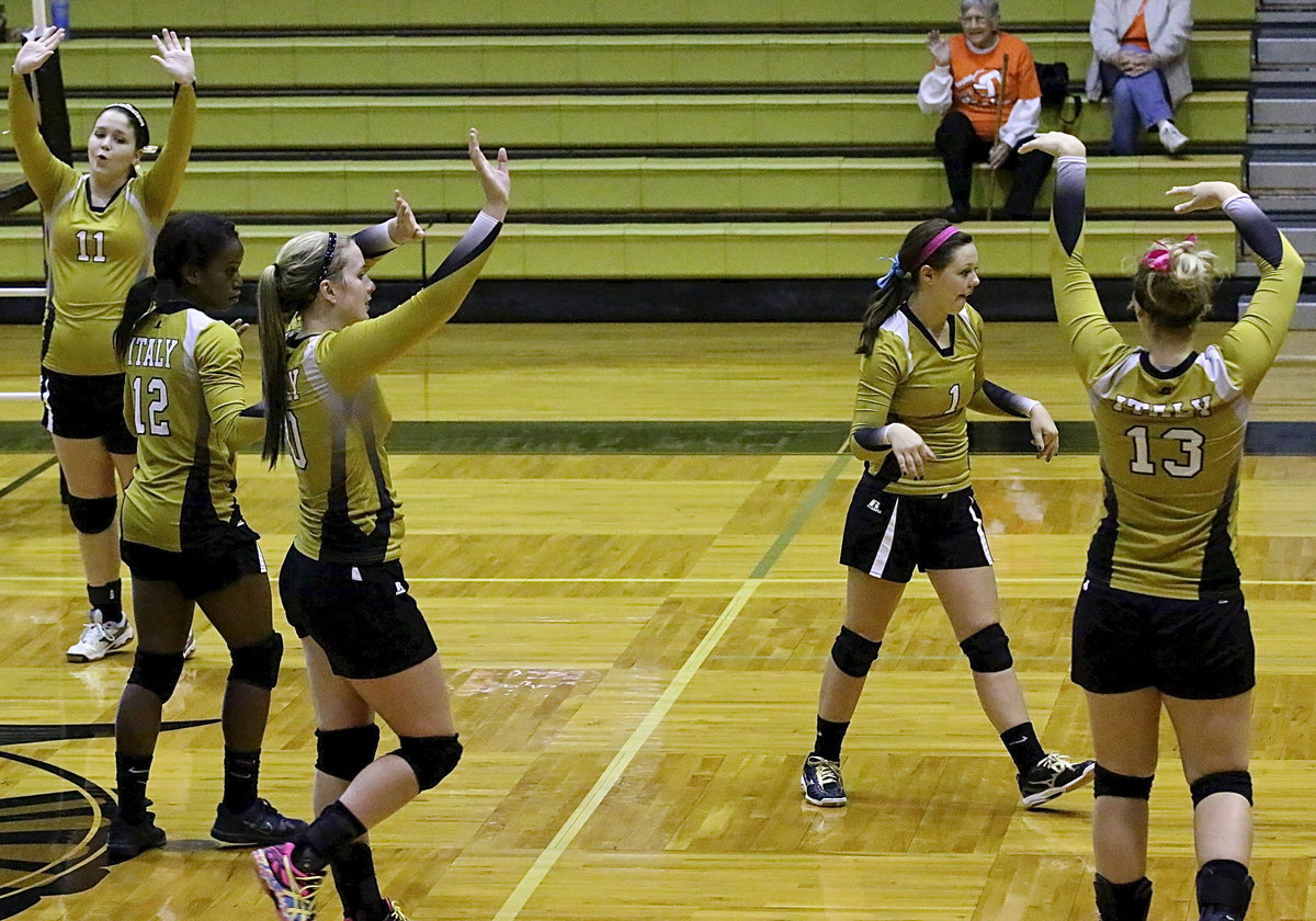 Image: The Lady Gladiators celebrate a point.