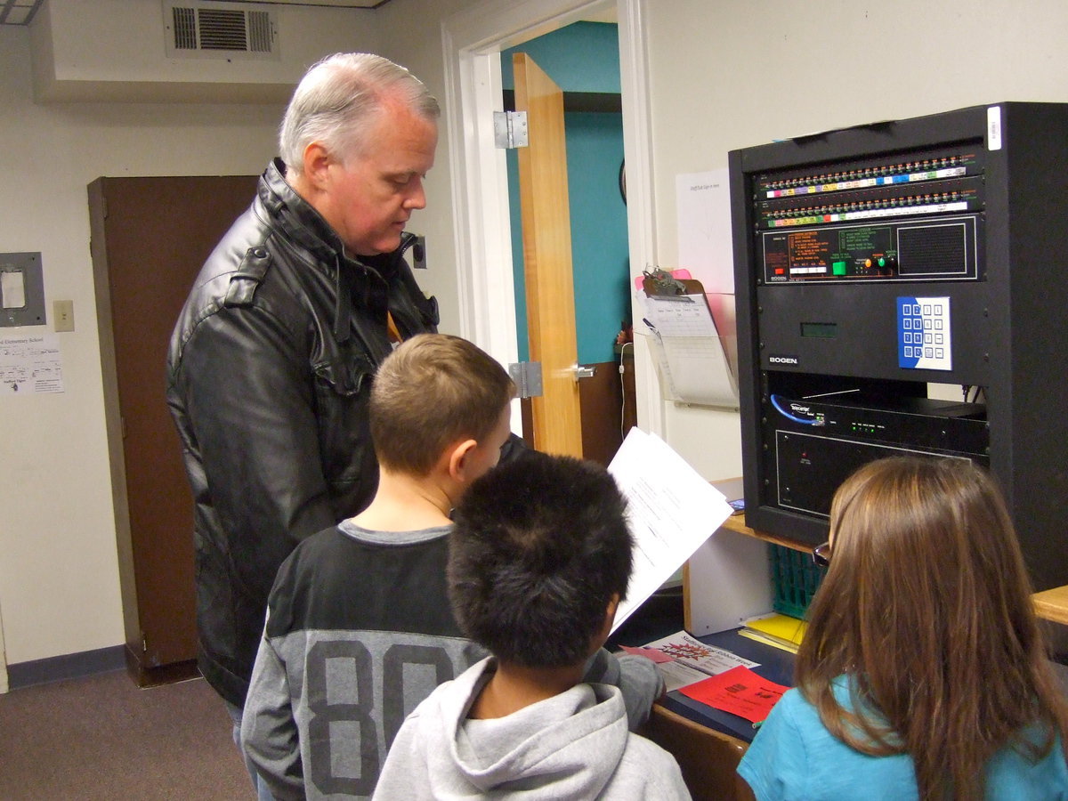 Image: Mr. Nash and Gabriel Perez, Jay Copeland and Morgan Chambers helped with the announcements for the morning.