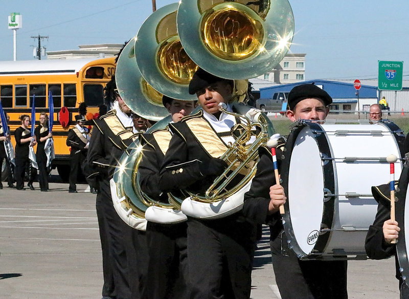 Image: Austin Crawford on base drum and David De La Hoya on tuba help lead their band mates to the practice field where last minute adjustments and musical practice runs made the difference.