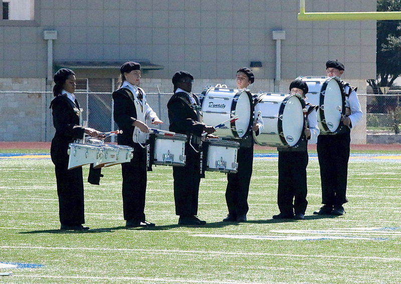 Image: The drum line adds sound ammunition to the performance.