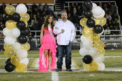 Image: 2013 Homecoming Nominee, Corl McCarthy, is escorted by her father, Carl McCarthy.