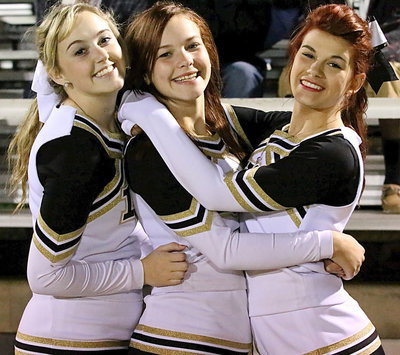 Image: United in arms are Italy Gladiator Cheerleaders Kelsey Nelson, Paige Little and Kristian Weeks.