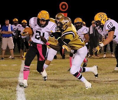 Image: Outside linebacker TaMarcus Sheppard(10) tackles cayuga for a loss of 3 yards.
