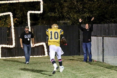 Image: After scoring a touchdown to give Italy a first-quarter lead, TaMarcus Sheppard(10) is greeted by Italy HS Principal Lee Joffre and school maintenance crew member Michael Chambers who celebrate Sheppard’s go ahead touchdown.