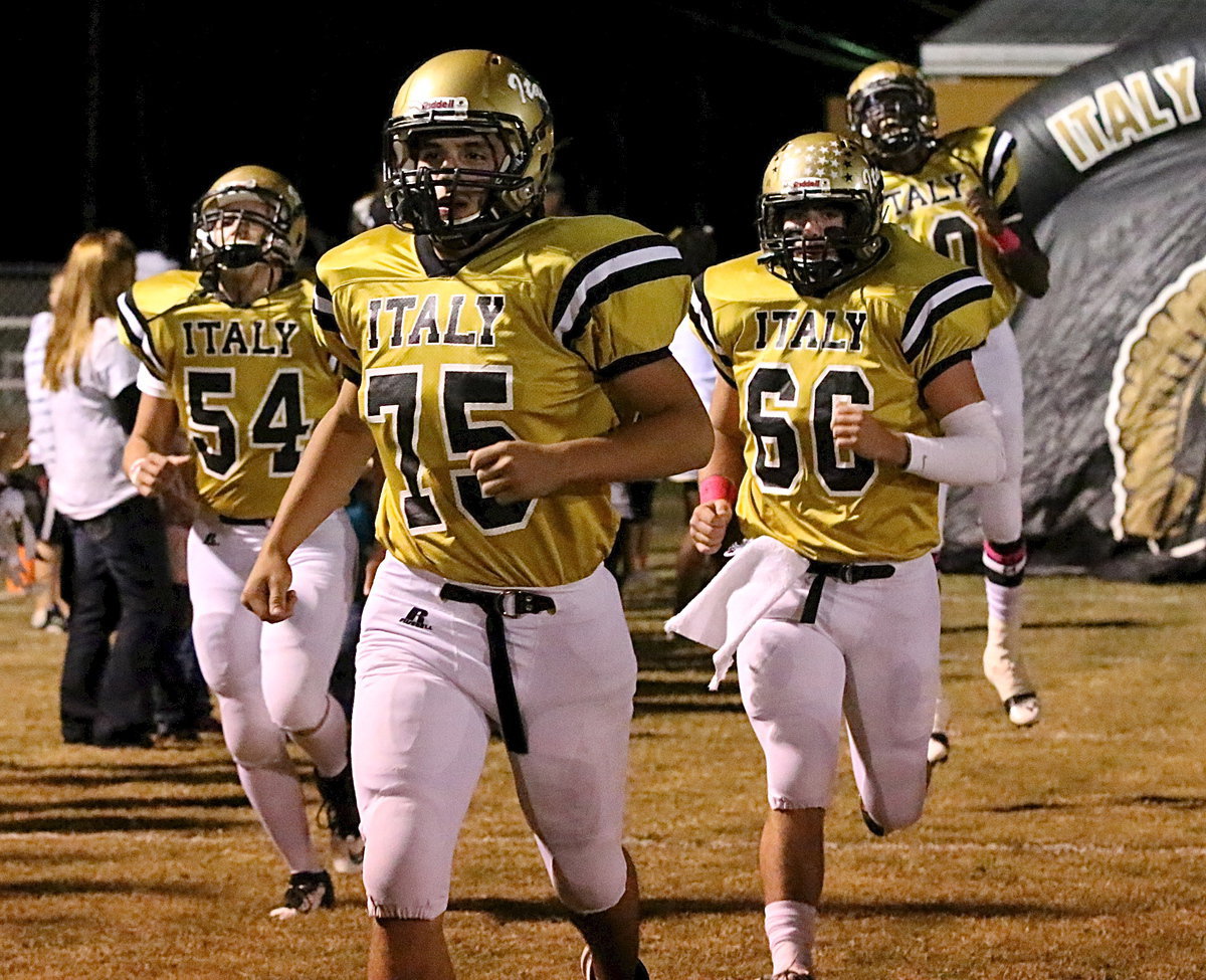 Image: Let’s get serious: Cody Medrano(75), Kyle Fortenberry(60), Bailey Walton(54) and TaMarcus Sheppard(10) take the field ready yo take down unbeaten Cayuga.