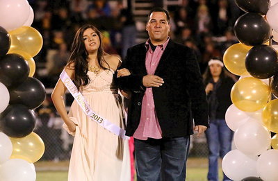Image: 2013 Homecoming Nominee, Adrianna Celis, is escorted by her father, Daniel Celis.