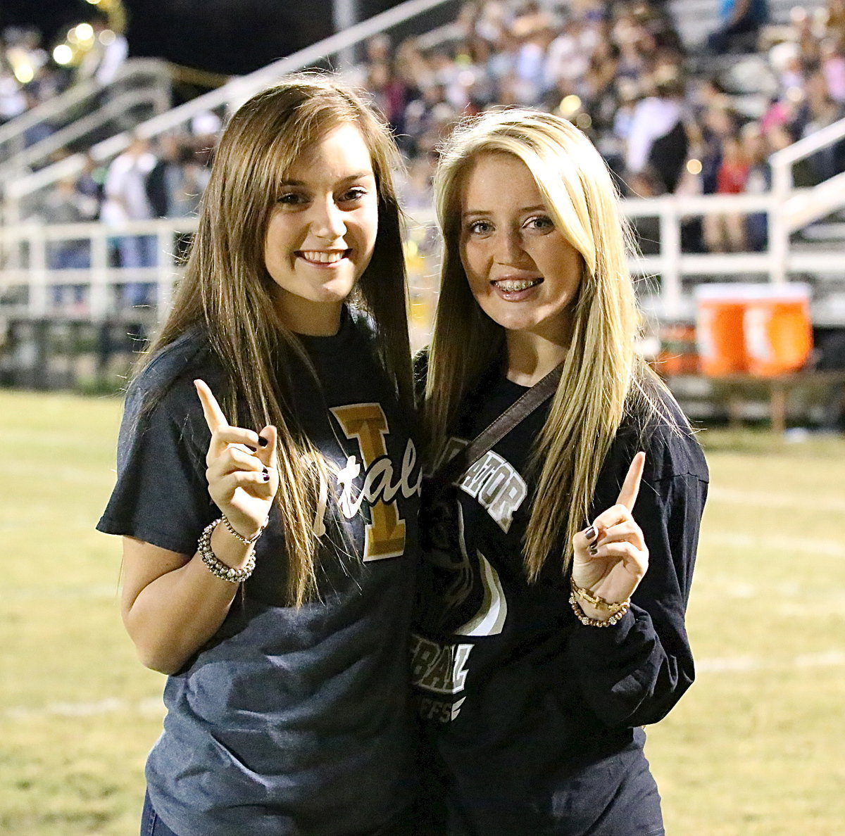 Image: Jozie Perkins and Hannah Washington are proud of their Gladiators for taking over 1st place in the district race.