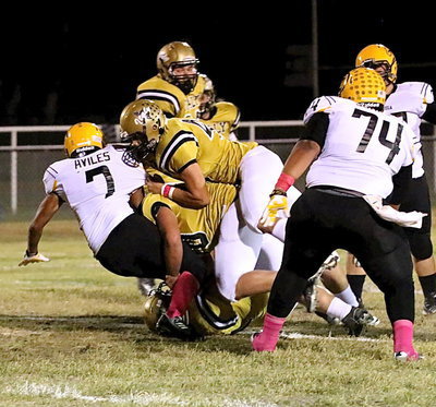 Image: Zain Byers(50) and Coby Bland(40) help stop Cayuga at the line-of-scrimmage.