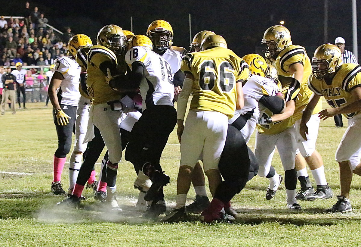 Image: TaMarcus Sheppard(10) squeezes thru for a touchdown behind center Kyle Fortenberry(66), guard Zain Byers(50), tackle Kevin Roldan(60), lead back Shad Newman(25) and guard Cody Medrano(75).