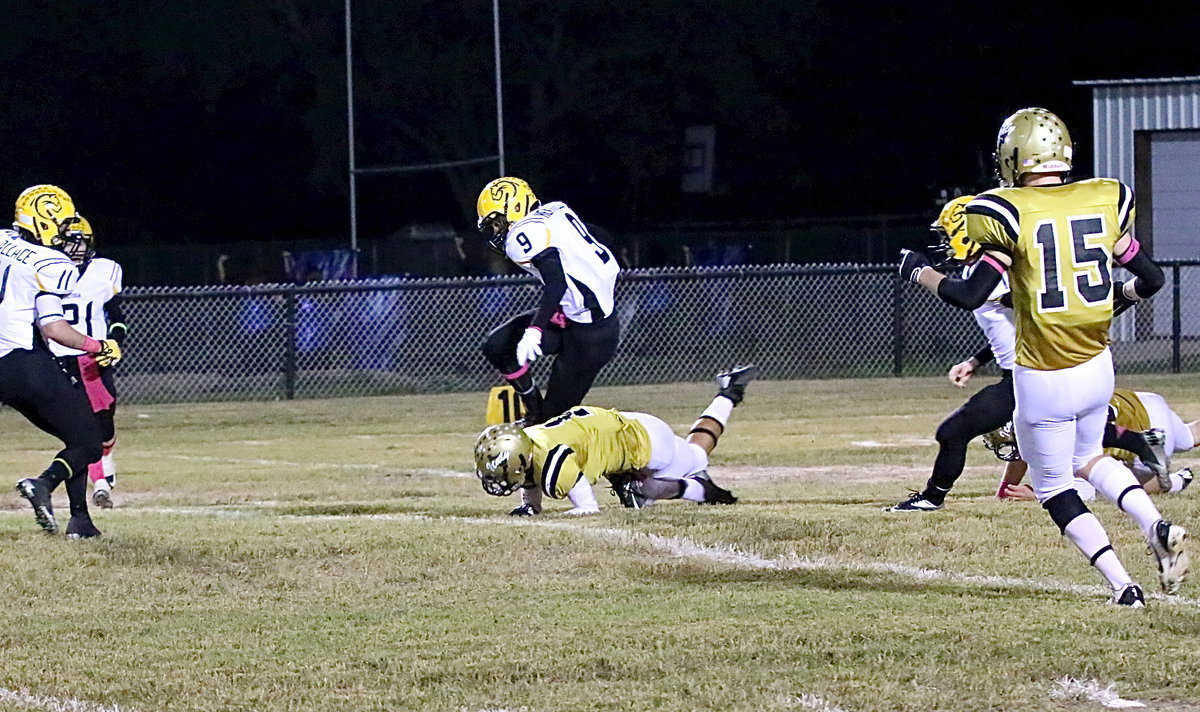 Image: Making a special teams tackle for Italy is sophomore Levi McBride(1).